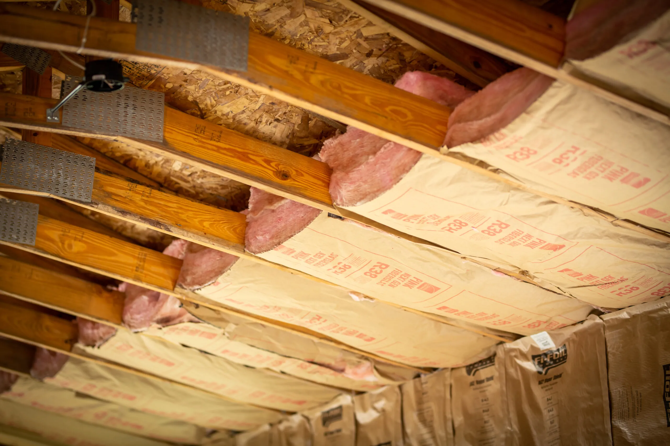 Fiberglass batt insulation installed between joists in a Los Angeles attic